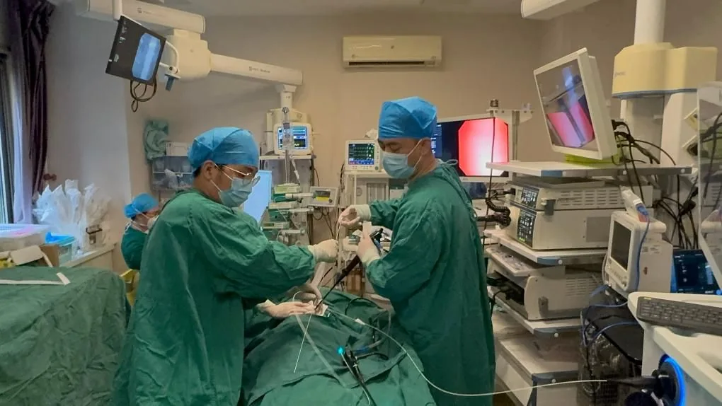 Hospital clinician using a thoracoscope during respiratory intervention; hospital supplied photograph