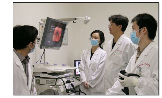Hospital endoscopy team demonstrating an endoscopic examination device