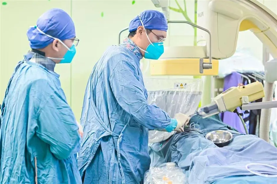 Xinhua Hospital doctors conducting a retinoblastoma interventional procedure, hospital-provided clinical photograph